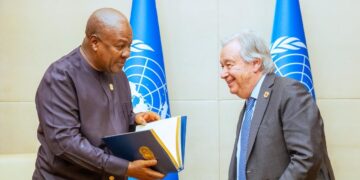 Ghana’s president presents a document during a meeting with the United Nations secretary-general at UN headquarters as part of diplomatic engagement on reparations discussions