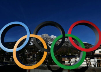 Olympic rings displayed at Milan-Cortina Winter Olympics venue in northern Italy against a mountain backdrop