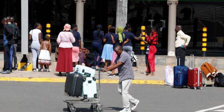 Travellers arrive at Jomo Kenyatta International Airport in Nairobi as an aviation workers’ strike causes flight delays and disruption.