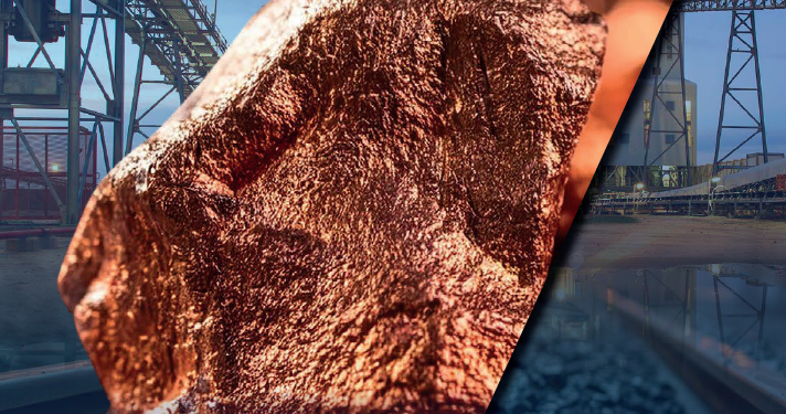 Copper ore sample with mining conveyors and rail infrastructure in an African mine setting.