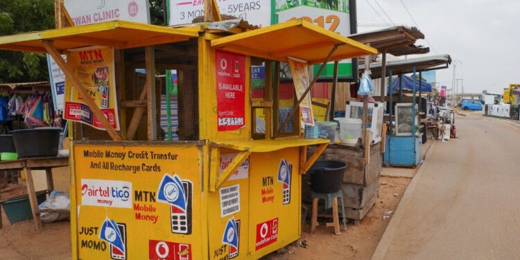 Mobile money agent kiosk serving customers in Accra, Ghana