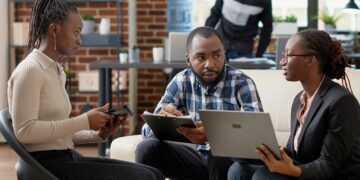 African business professionals discussing digital trade partnerships supporting AfCFTA commerce