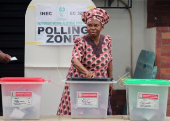 Nigerian voter casting ballot at an INEC polling unit during a national election exercise.