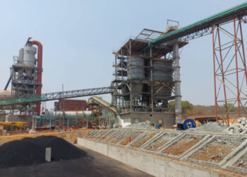 Industrial lithium processing facility under construction at Prospect Lithium’s Arcadia site near Harare, featuring metal reactors, conveyor belts and elevated piping systems