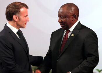 French President Emmanuel Macron shakes hands with South African President Cyril Ramaphosa during diplomatic meeting amid G7 tensions