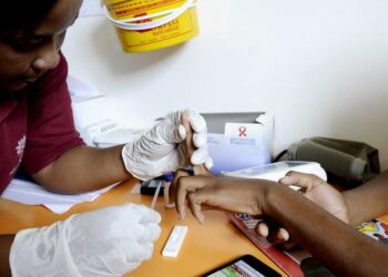 Healthcare worker administering HIV prevention injection during clinic visit in Eswatini
