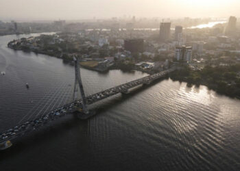 Aerial view of Lagos skyline and bridge over lagoon highlighting coastal flood risk in Nigeria