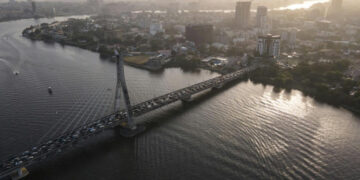 Aerial view of Lagos skyline and bridge over lagoon highlighting coastal flood risk in Nigeria