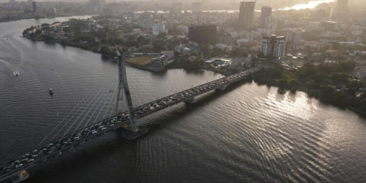 Aerial view of Lagos skyline and bridge over lagoon highlighting coastal flood risk in Nigeria