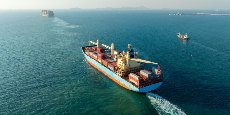 Cargo ships sailing through the Red Sea shipping route as Middle East conflict threatens global trade and energy supplies