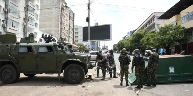 Mozambican security forces conduct a raid at a spare parts market where 42 Nigerians were reportedly arrested