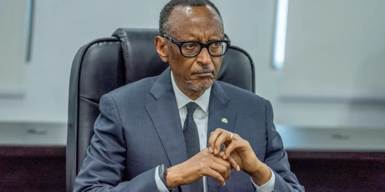 Rwanda President Paul Kagame sits stern-faced during official meeting, hands clasped, appearing visibly displeased