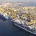 Container ships loading cargo at an African port backed by Gulf investment