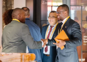 Delegates greet each other at the Africa Energies Summit in London during networking discussions on African oil and gas investment