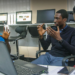 African technology entrepreneurs collaborating in a digital innovation hub