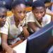 Ghanaian schoolgirls learning computer programming during a digital skills training session as Ghana expands AI education initiatives
