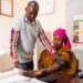 Healthcare worker checks a patient’s blood pressure at a public clinic in Dakar, Senegal
