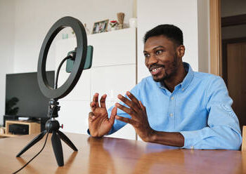 African digital creator using smartphone and ring light as Malawi expands creator economy monetisation