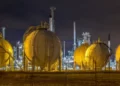 LNG storage tanks at an African liquefied natural gas export terminal at night