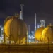 LNG storage tanks at an African liquefied natural gas export terminal at night