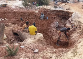 Artisanal miners digging for gold at an informal mining site in Mali as authorities move to curb illegal gold production.