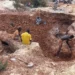 Artisanal miners digging for gold at an informal mining site in Mali as authorities move to curb illegal gold production.