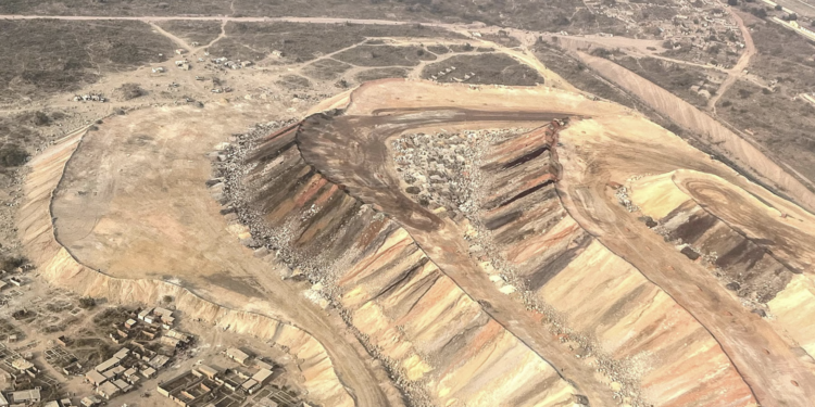 Aerial view of Manono lithium mine in Democratic Republic of Congo showing large open-pit excavation and surrounding settlements