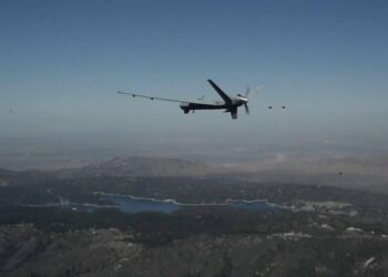 US MQ-9 Reaper drone conducting surveillance flight over rugged terrain during counter-terrorism operations