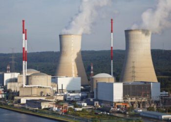 Nuclear power plant with cooling towers and reactor buildings, representing Rwanda’s planned nuclear energy programme