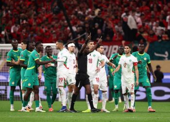 Senegal players confront referee during AFCON final dispute against Morocco after controversial decision