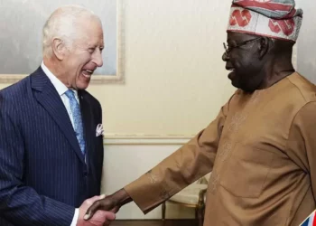 President Bola Tinubu shakes hands with King Charles III during a diplomatic meeting in London