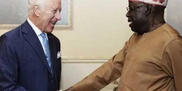 President Bola Tinubu shakes hands with King Charles III during a diplomatic meeting in London