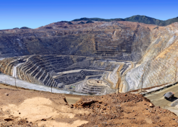 Open-pit copper mine in Zambia’s Copperbelt showing terraced excavation and heavy haul roads