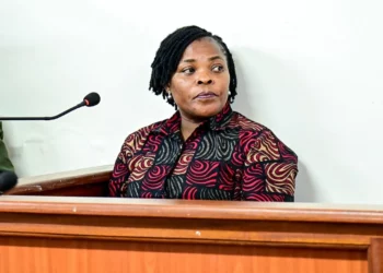 Agnes Nandutu speaks at a microphone during a public appearance in Uganda