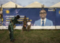Benin election campaign setting with tents and banner, as finance minister Romuald Wadagni emerges as frontrunner to succeed President Patrice Talon