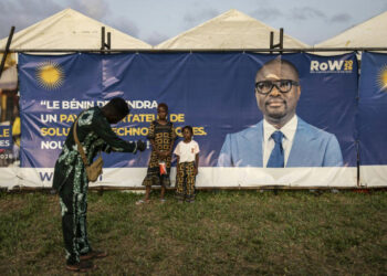 Benin election campaign setting with tents and banner, as finance minister Romuald Wadagni emerges as frontrunner to succeed President Patrice Talon