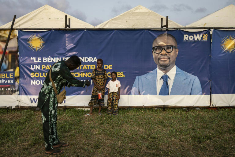 Benin election campaign setting with tents and banner, as finance minister Romuald Wadagni emerges as frontrunner to succeed President Patrice Talon