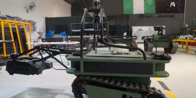 Autonomous tracked ground vehicle for mine detection displayed inside Terra Industries workshop in Nigeria
