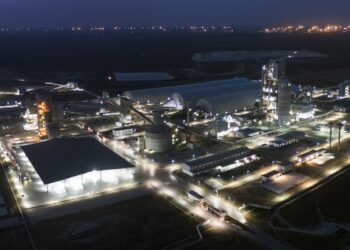 Aerial night view of Dangote Refinery complex in Lagos, showing illuminated processing units, storage facilities and industrial infrastructure