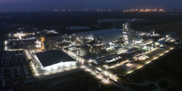 Aerial night view of Dangote Refinery complex in Lagos, showing illuminated processing units, storage facilities and industrial infrastructure