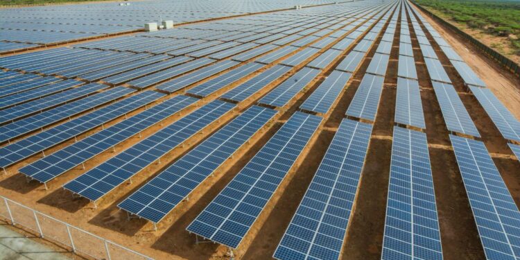 Large-scale solar farm in Africa showing rows of photovoltaic panels, illustrating renewable energy expansion and electrification efforts