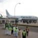 Nigeria Air aircraft on runway with passengers and officials gathered amid aviation fuel crisis