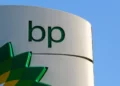 BP logo displayed on a fuel station sign against a clear blue sky.