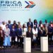 French President Emmanuel Macron and Kenyan President William Ruto stand on stage with delegates during the Africa Forward Summit in Nairobi on May 11, 2026, as leaders discuss investment, debt and global financial reform