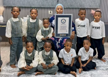 Halima Cissé poses with her nine children in Mali as the world-famous nonuplets celebrate their fifth birthday alongside a Guinness World Records certificate
