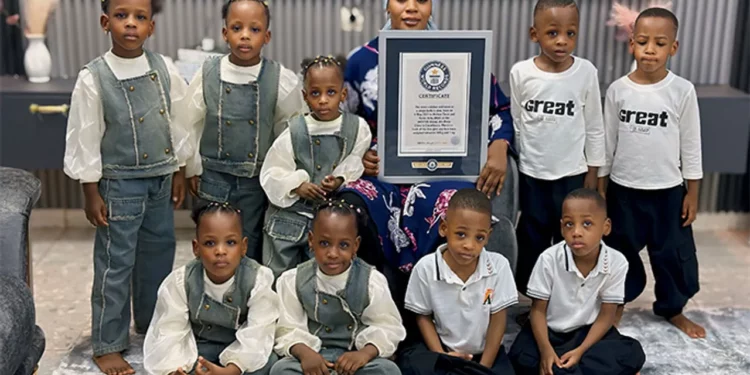 Halima Cissé poses with her nine children in Mali as the world-famous nonuplets celebrate their fifth birthday alongside a Guinness World Records certificate