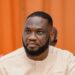 Member of Parliament Kwame Frimpong seated during an official event in Ghana