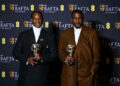 Nigerian filmmakers Akinola Davies Jr. and Wale Davies pose with BAFTA awards at the EE BAFTA Film Awards, highlighting Nollywood’s growing international recognition