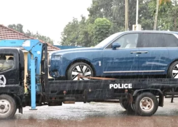 Ugandan police tow a blue Rolls-Royce Cullinan linked to parliamentary Speaker Anita Among during a corruption investigation in Kampala