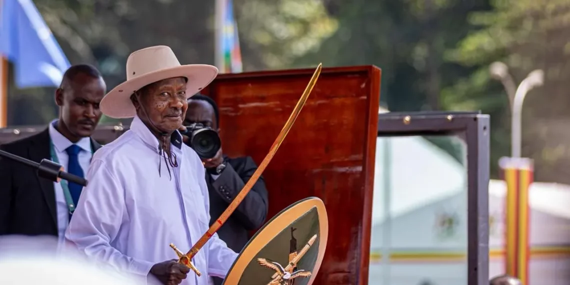 Uganda President Yoweri Museveni holds a ceremonial sword and shield during his swearing-in ceremony in Kampala amid growing debate over succession politics
